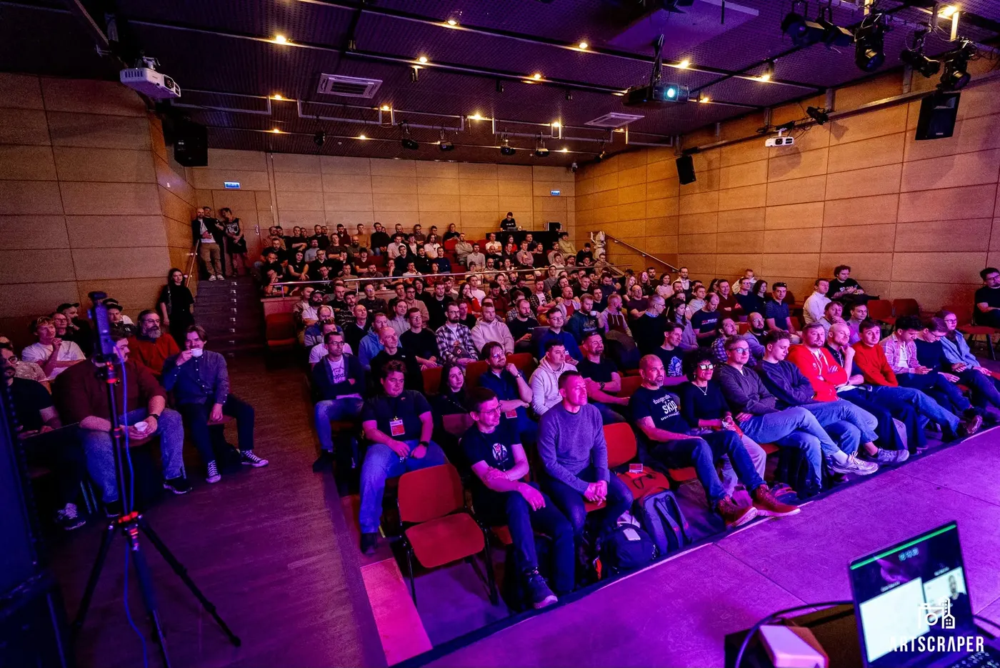 A full conference hall watching a talk