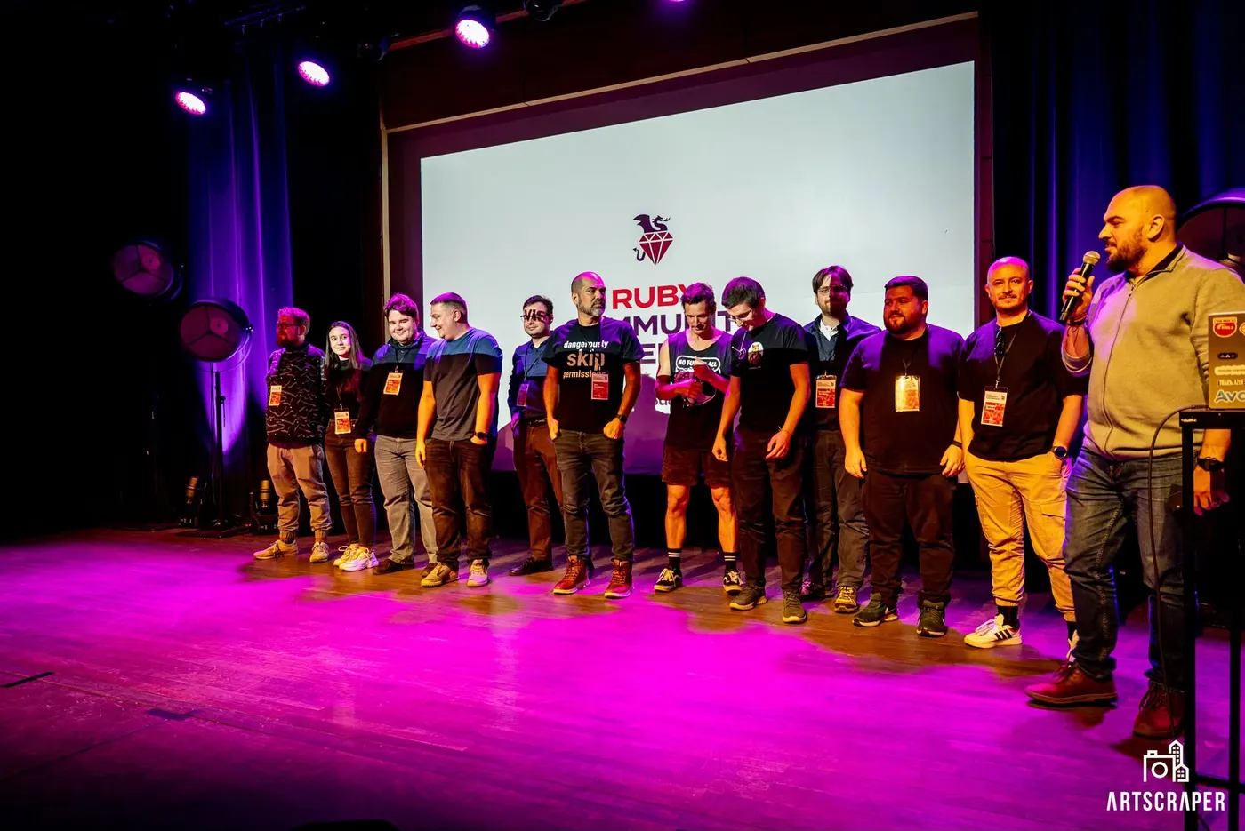 Speakers and organisers lined up on stage at the end of the day