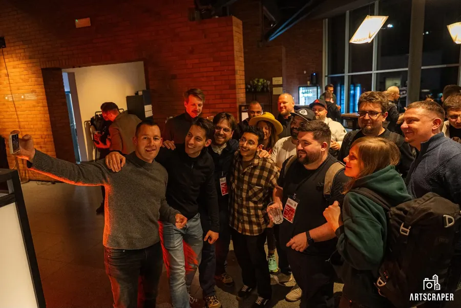 Attendees squeezing into a group selfie