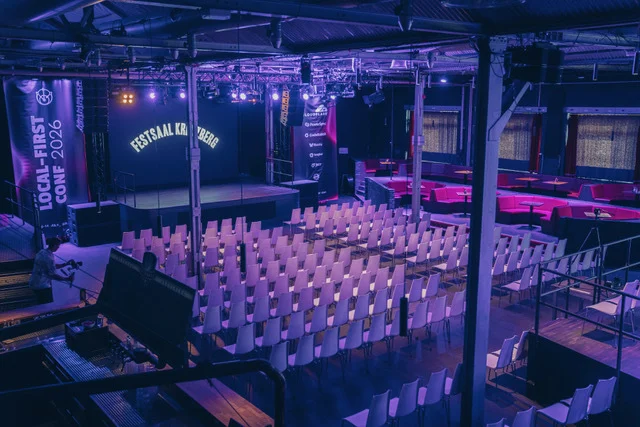 The main hall of Festsaal Kreuzberg set up with rows of chairs facing the stage